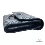 Opposite side profile of Furla wallet on chain with black leather gusset