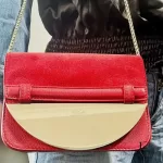 Furla red suede and leather clutch with gold-tone chain, carried crossbody