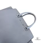 Michael Kors Selma grey Saffiano satchel, side view with handles