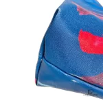 Desigual blue multicolour painterly tote bag, close-up of blue leather and tan trim