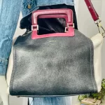 Furla tri-colour two-way handbag in black, white and maroon, worn crossbody