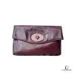 Coach maroon leather chain sling bag, flap closed, flat view