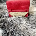Furla red suede and leather clutch with gold-tone chain, flap detail on faux fur