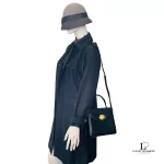 Givenchy black leather 2-way handbag, worn crossbody on a mannequin, side view