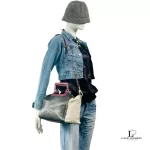 Furla tri-colour two-way handbag in black, white and maroon, styled on a mannequin with a denim jacket
