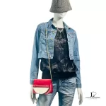 Furla red suede and leather clutch with gold-tone chain, worn on a mannequin, side view