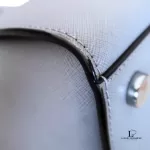Michael Kors Selma grey Saffiano satchel, close-up of side seam and edge