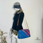Desigual blue multicolour painterly tote bag, worn crossbody on a mannequin