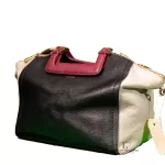 Furla tri-colour two-way handbag in black, white and maroon, side studio view