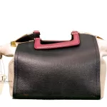 Furla tri-colour two-way handbag in black, white and maroon, front studio view
