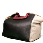 Furla tri-colour two-way handbag in black, white and maroon, angled studio view
