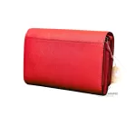 Tory Burch coral pink leather clutch with gold-tone chain, side studio view