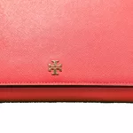 Tory Burch coral pink leather clutch with gold-tone chain, front detail with gold-tone logo