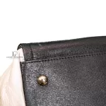 Furla tri-colour two-way handbag in black, white and maroon, close-up of black leather and stud