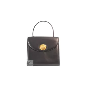 Givenchy black leather 2-way handbag, front view with gold-tone oval plaque
