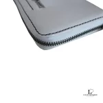 Marc by Marc Jacobs white leather zip-around long wallet, close-up of white leather and zip
