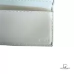 Coach lavender signature monogram billfold wallet, opened to show the inner compartments