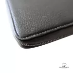 Celine taupe leather long zip-around wallet, close-up of grained leather and zip edge