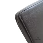 Celine taupe leather long zip-around wallet, close-up of grained leather and zip edge