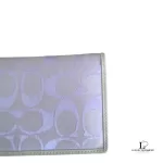 Coach lavender signature monogram billfold wallet, close-up of the signature monogram