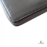 Celine taupe leather long zip-around wallet, close-up of grained leather and zip edge