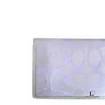 Coach lavender signature monogram billfold wallet, close-up of the signature monogram