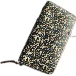 Tory Burch floral long zip wallet with pink panel, angled view with zip