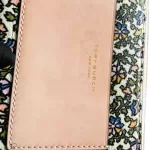 Tory Burch floral long zip wallet with pink panel, floral print and pink panel detail