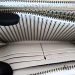Marc by Marc Jacobs white leather zip-around long wallet, striped interior lining and card slots