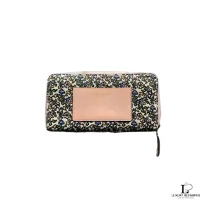 Pre-loved Tory Burch floral long zip wallet with pink panel, front view – secondhand designer, NZ
