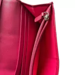 Coach signature monogram flap wallet with fuchsia trim, fuchsia interior