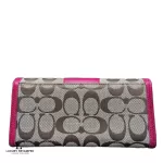 Coach signature monogram flap wallet with fuchsia trim, front view