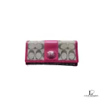 Pre-loved Coach signature monogram flap wallet with fuchsia trim, front view – secondhand designer, NZ