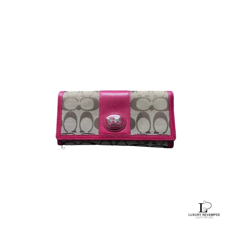Pre-loved Coach signature monogram flap wallet with fuchsia trim, front view – secondhand designer, NZ