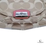 Coach Kristin signature hobo bag with salmon pink leather trim, front pocket clasp and logo patch