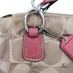 Coach Kristin signature hobo bag with salmon pink leather trim, silver-tone hardware and pink leather tab