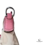 Coach Kristin signature hobo bag with salmon pink leather trim, handle attachment and side detail