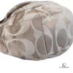 Coach Kristin signature hobo bag with salmon pink leather trim, close-up of the signature C fabric