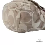 Coach Kristin signature hobo bag with salmon pink leather trim, close-up of the signature C fabric