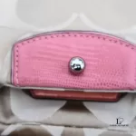 Coach Kristin signature hobo bag with salmon pink leather trim, front pocket clasp and logo patch
