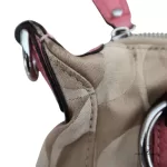 Coach Kristin signature hobo bag with salmon pink leather trim, handle attachment and side detail