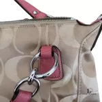 Coach Kristin signature hobo bag with salmon pink leather trim, silver-tone hardware and pink leather tab