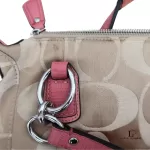 Coach Kristin signature hobo bag with salmon pink leather trim, silver-tone hardware and pink leather tab