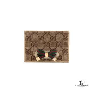 Pre-loved Gucci Sherryline beige monogram bifold card wallet, front view – secondhand designer, NZ