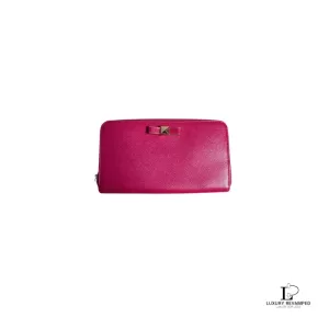 Pre-loved Furla magenta pebbled leather long full zip wallet, front view – secondhand designer, NZ
