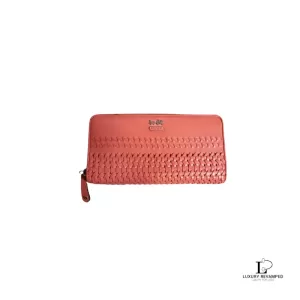 Pre-loved Coach salmon pink weave-style leather long full zip wallet, front view – secondhand designer, NZ