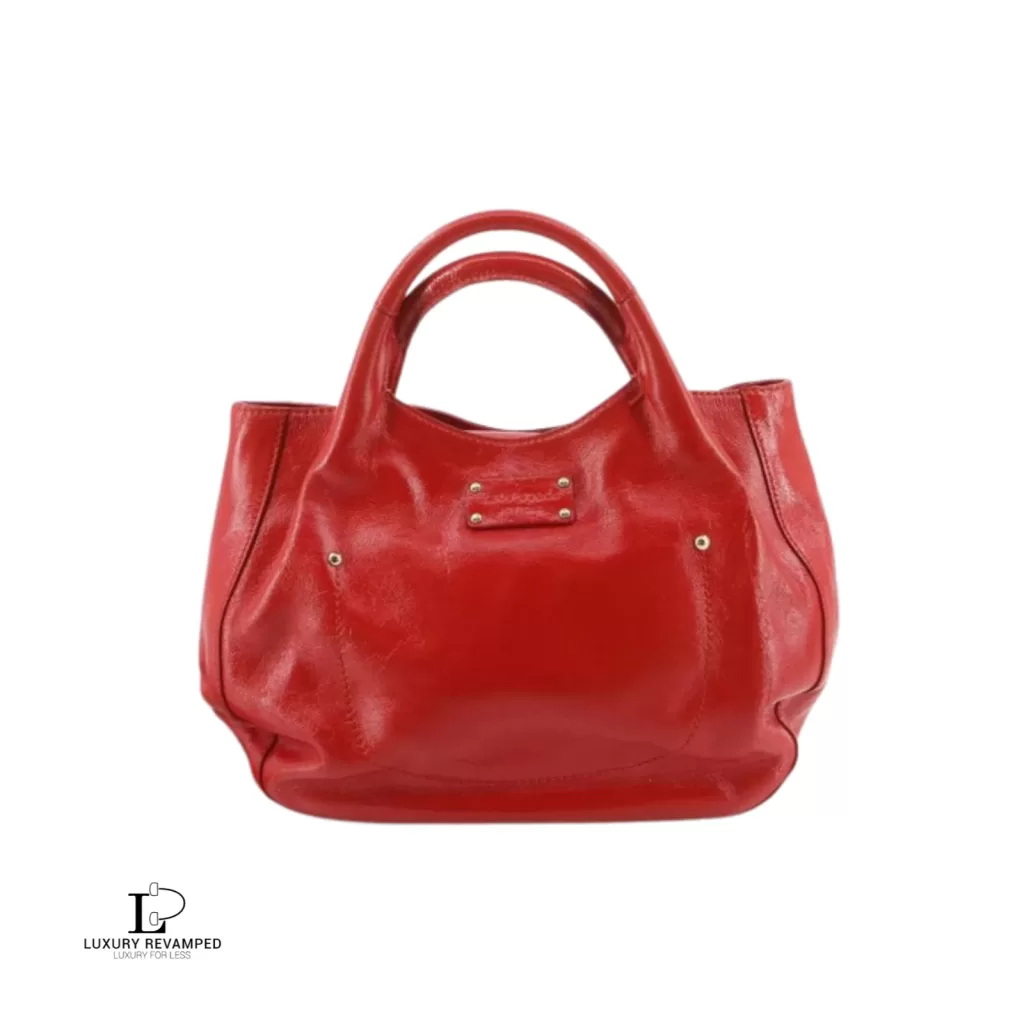 Pre-loved Kate Spade red patent leather enamel handbag, front view – secondhand designer, NZ