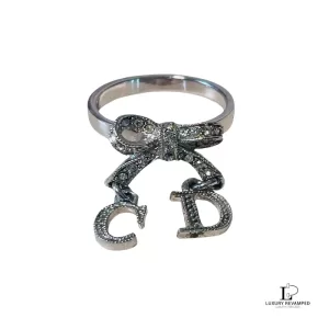 Pre-loved Christian Dior CD initials bow silver ring, size 5, front view – secondhand designer, NZ