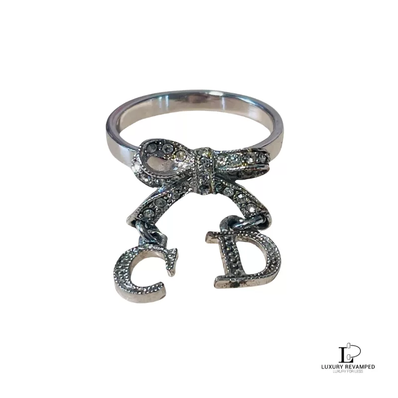 Pre-loved Christian Dior CD initials bow silver ring, size 5, front view – secondhand designer, NZ