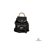 Pre-loved Gucci black nylon and patent leather backpack with bamboo handle, front view – secondhand designer, NZ